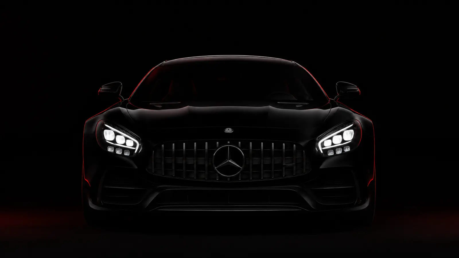АВТО 1001128 чёрный Mercedes AMG GT в темноте с фарами