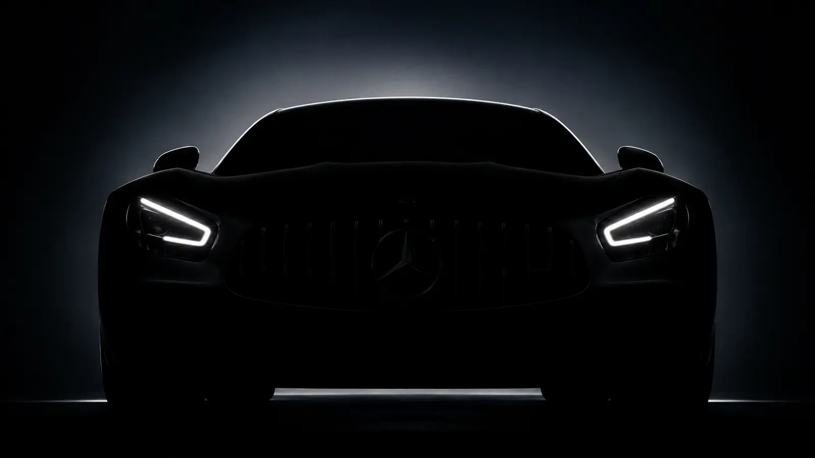 АВТО 1000984 чёрный Mercedes AMG GT в темноте с фарами