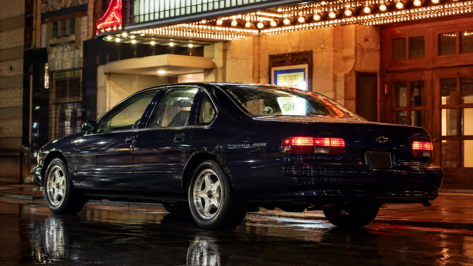 АВТО 1000719 тёмно-синий Chevrolet Impala SS у театра в стиле 90-х