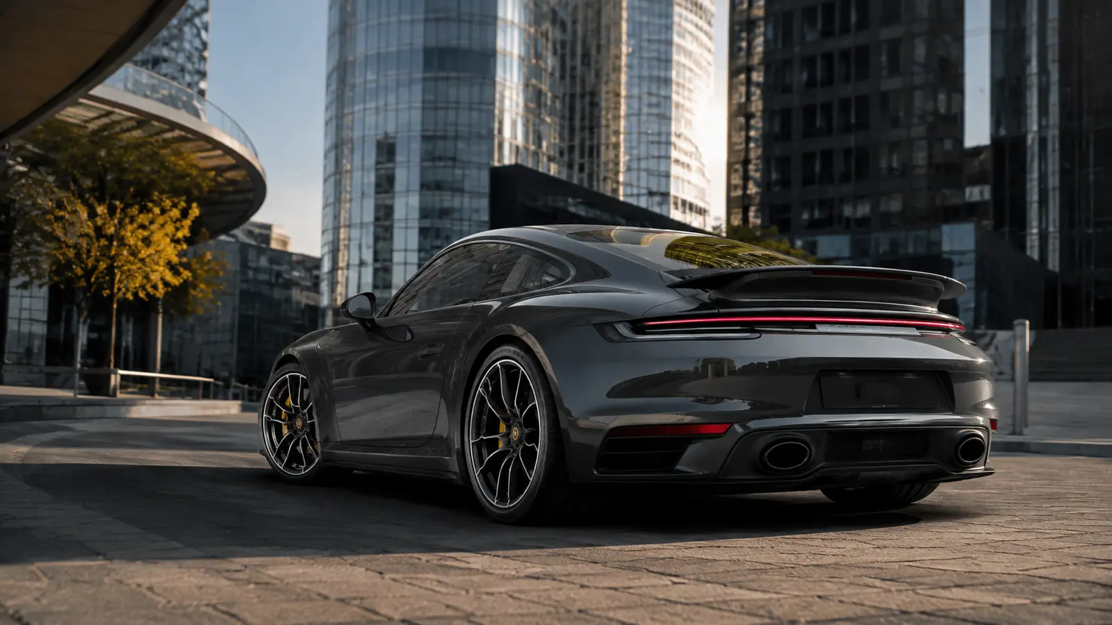 АВТО 1000942 серый Porsche 911 Turbo S у делового квартала